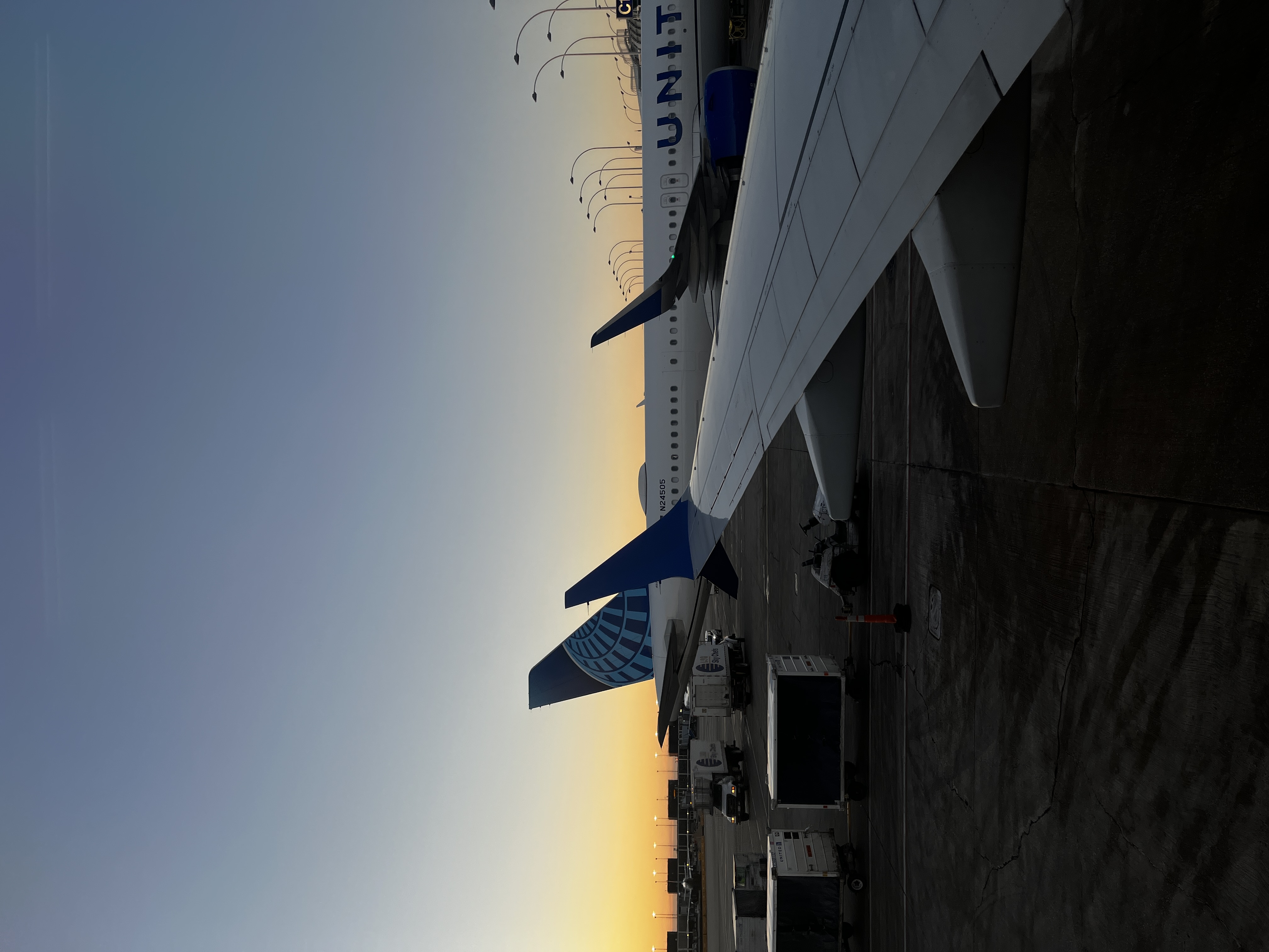 Airplane wing at sunset